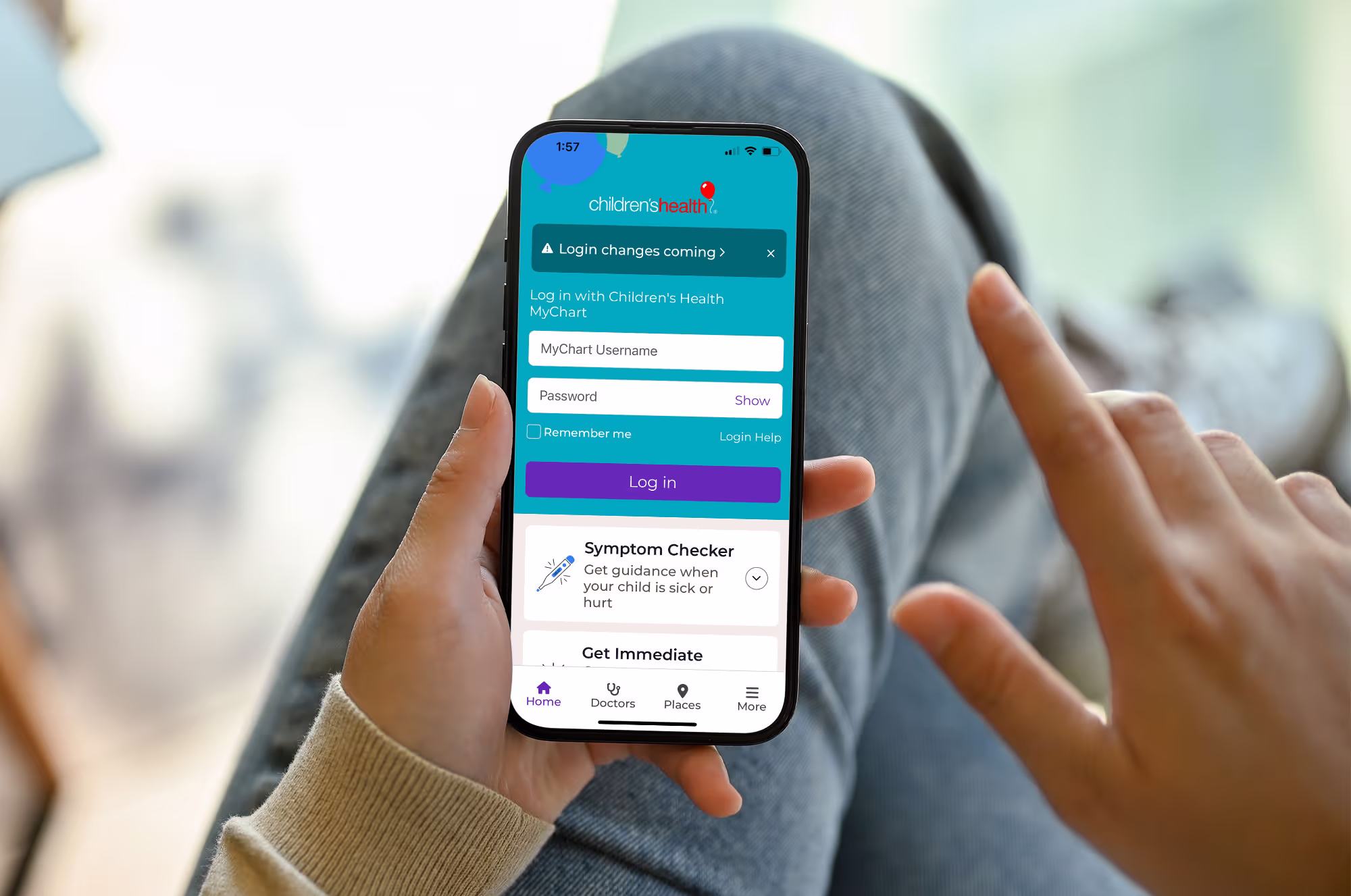 A person holding a cell phone with a blue screen.